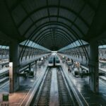 a train station with a train on the tracks