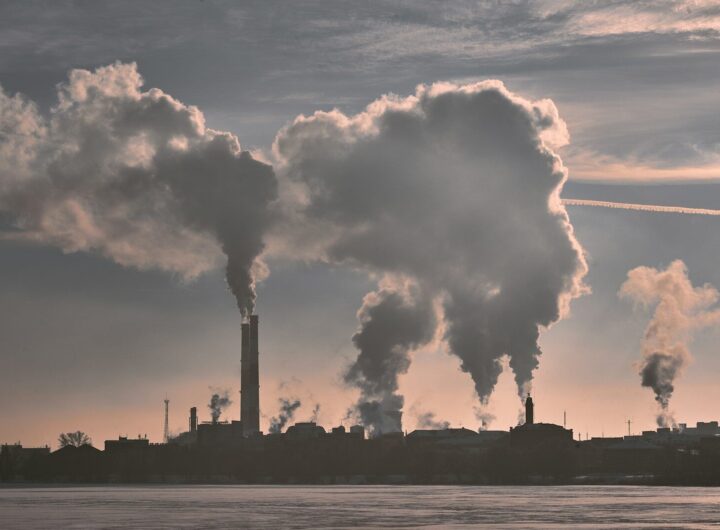 silhouette of building under white clouds during daytime