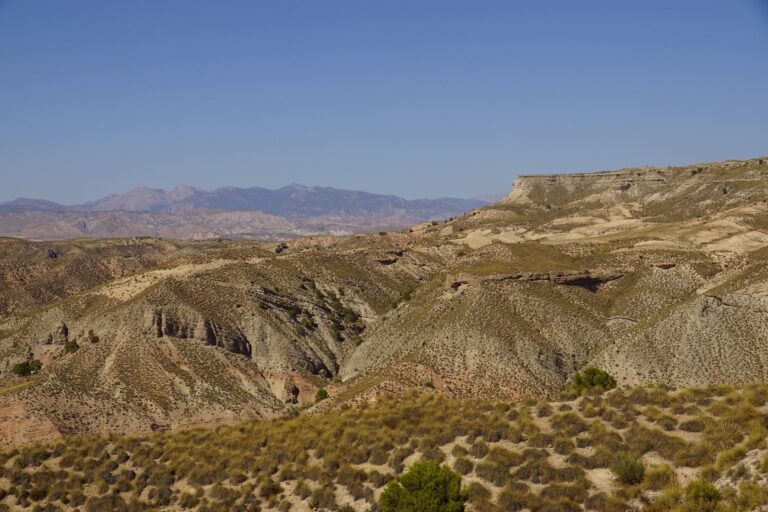 Stunning landscape showcasing rugged, dry mountains under a clear blue sky in Spain.