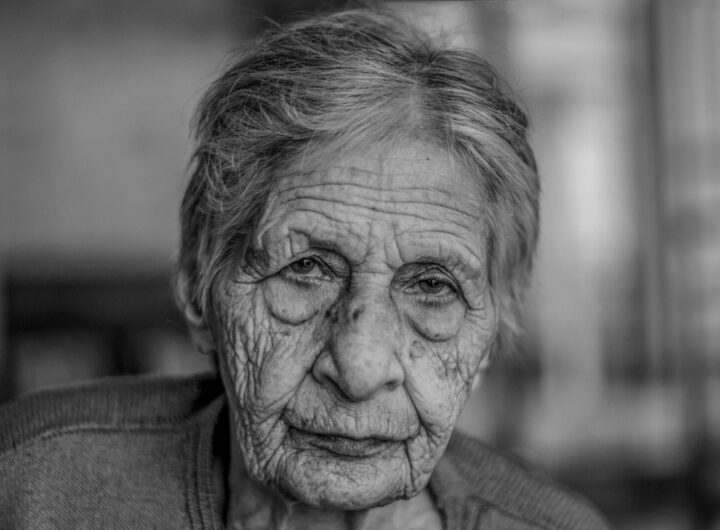 old woman in grey shirt