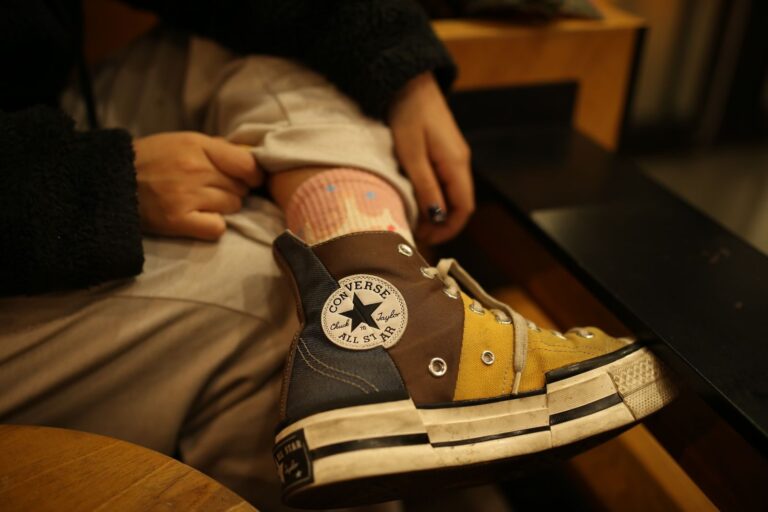 Close-up of Converse All Star sneakers showcasing a multi-color design, perfect for casual fashion.