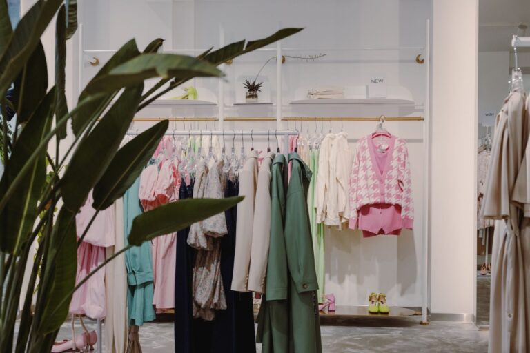Vibrant clothing rack with diverse apparel in a contemporary boutique setting.